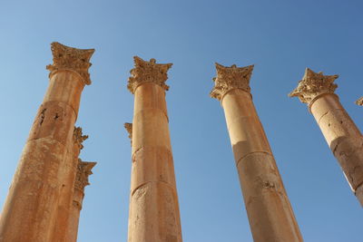 Low angle view of historical building against blue sky