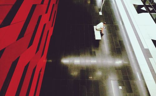 Low angle view of person walking on illuminated road