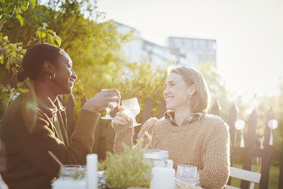 Female friends having meal in garden