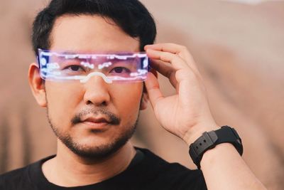 Asian man with future digital glasses,future technology concept.