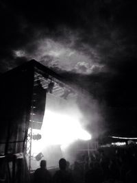 Silhouette of people against sky