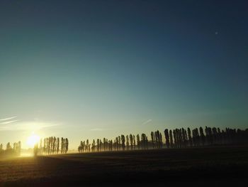 Panoramic view of silhouette landscape against clear sky during sunset