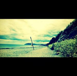 Scenic view of sea against cloudy sky