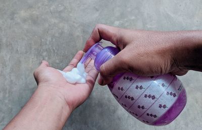 Close-up of hand holding hands