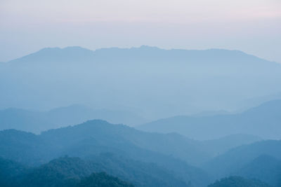 Wide view layer of mountain with sunrise background