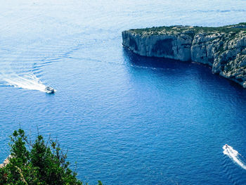 High angle view of sailboats on sea