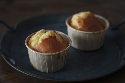 There are several delicious lemon honey cupcakes just made on the table