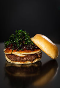 Close-up of cake on plate against black background