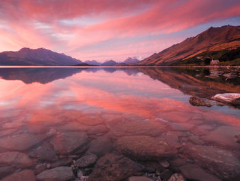 Scenic view of lake against sky during sunset