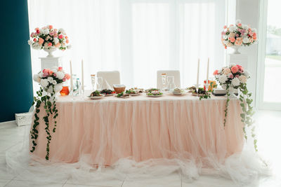 Flower vase on table at home