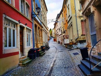 Narrow alley amidst buildings in town