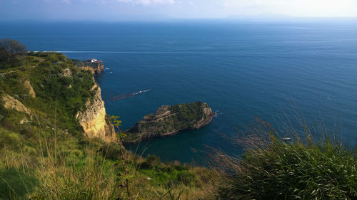 Scenic view of sea against blue sky