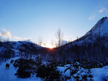 Scenic view of snow covered landscape against sky