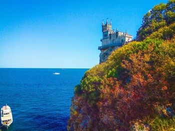 Scenic view of sea against clear blue sky