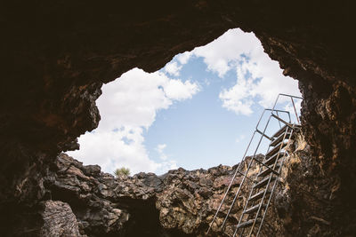 Low angle view of metallic staircase in cave