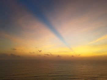 Scenic view of sea against orange sky