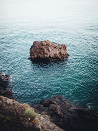 High angle view of rock formation in sea