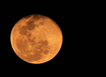 Low angle view of moon against sky at night