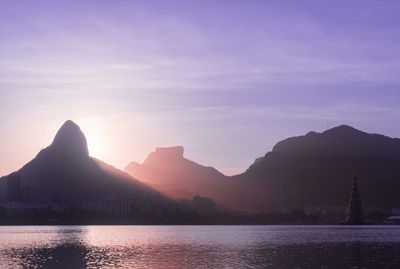 Scenic view of silhouette mountains against sky during sunset