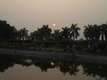 Reflection of trees in calm lake