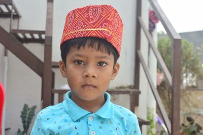 Portrait of boy standing outdoors