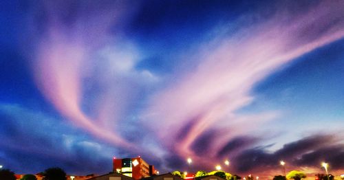 Low angle view of illuminated rainbow against sky at night