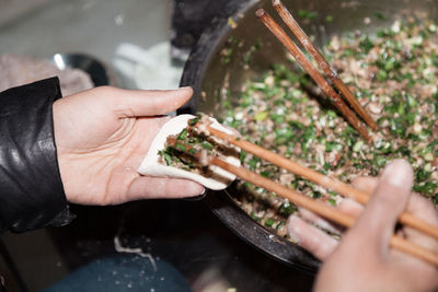 Close-up of man preparing food