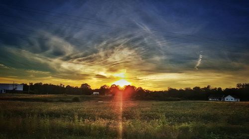 Scenic view of landscape at sunset