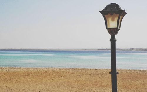 Scenic view of beach against clear sky