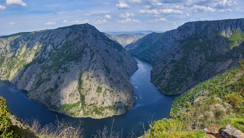 Panoramic view of rocks and mountains against sky