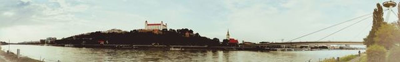 Panoramic view of bridge over river against sky