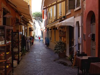 Narrow alley amidst buildings in city