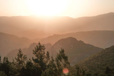 Scenic view of mountains against sky during sunset