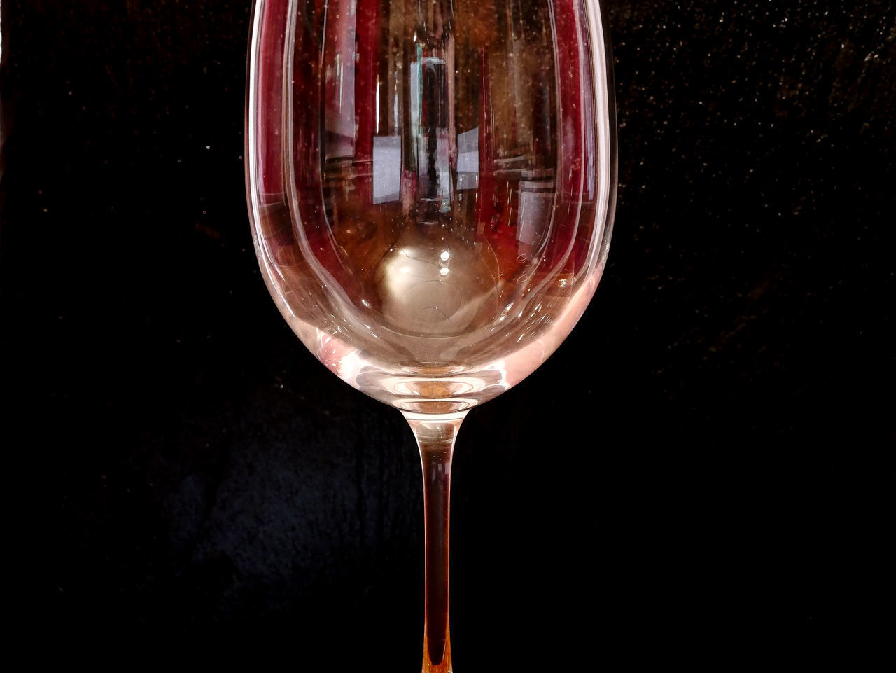 CLOSE-UP OF BEER GLASS ON TABLE