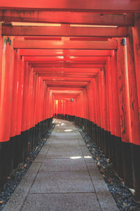 Empty footpath leading towards temple in building