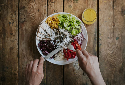 Directly above shot of hand holding food