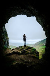 Rear view of man walking on mountain