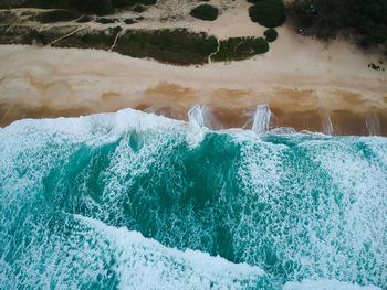 High angle view of water splashing in sea