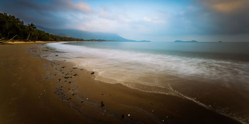 Scenic view of beach against sky