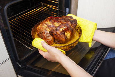 Cropped hand of man preparing food