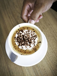 High angle view of coffee cup on table