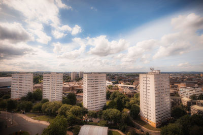 Buildings in city against sky