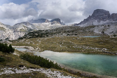 Scenic view of lake and mountains against sky