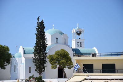 Low angle view of building against clear blue sky