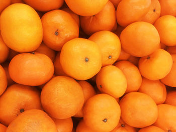 Full frame shot of oranges at market stall