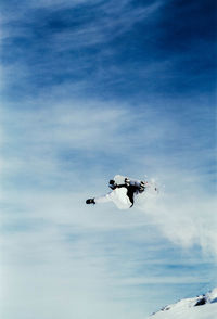 Low angle view of snowboarder in the sky