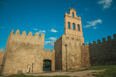 Low angle view of historical building against blue sky