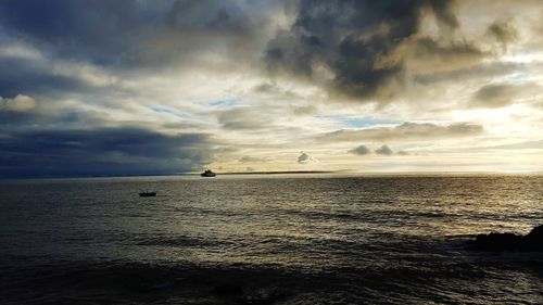 Scenic view of sea against dramatic sky