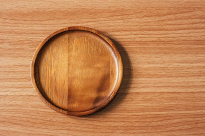 Directly above shot of beer on wooden surface