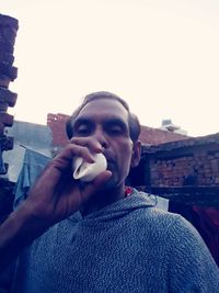 Portrait of young man looking at camera